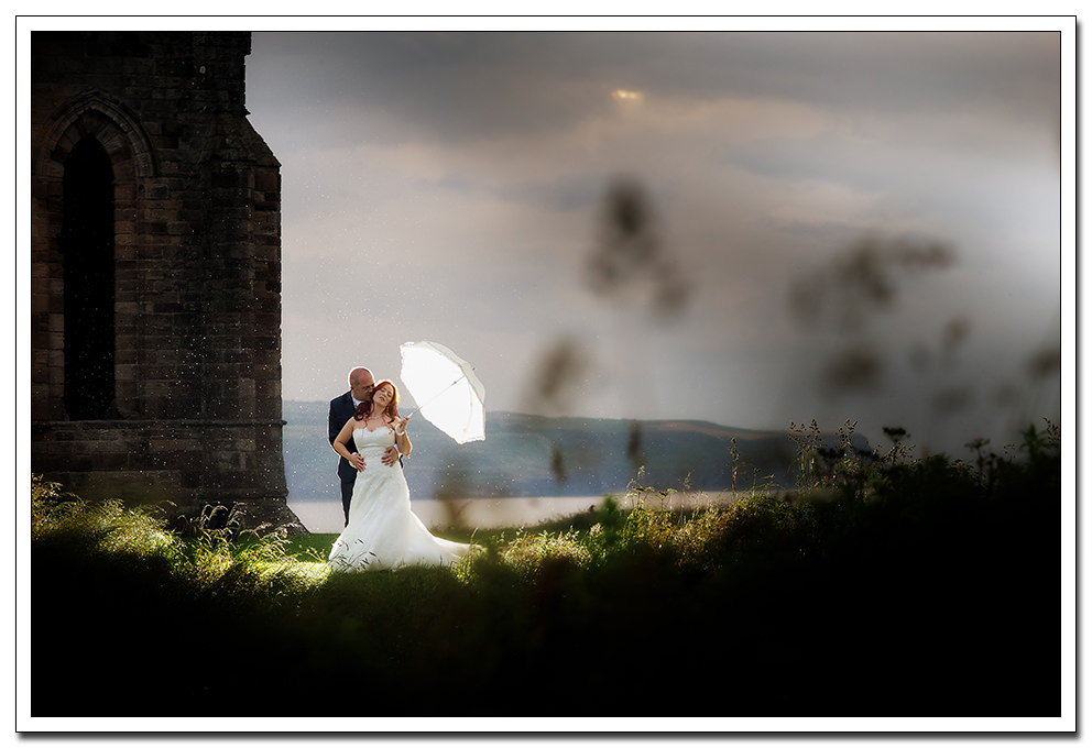 bride and groom at whitby abbey
