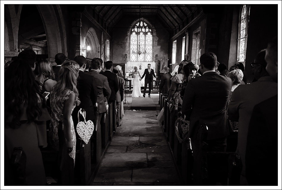 bride and groom exiting the church