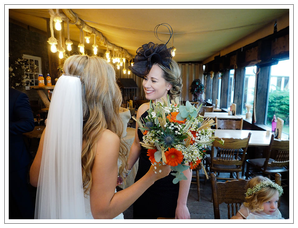 guests congratulating the bride at crossbutts stables