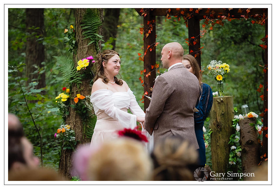 wedding ceremony in the woods of camp katur