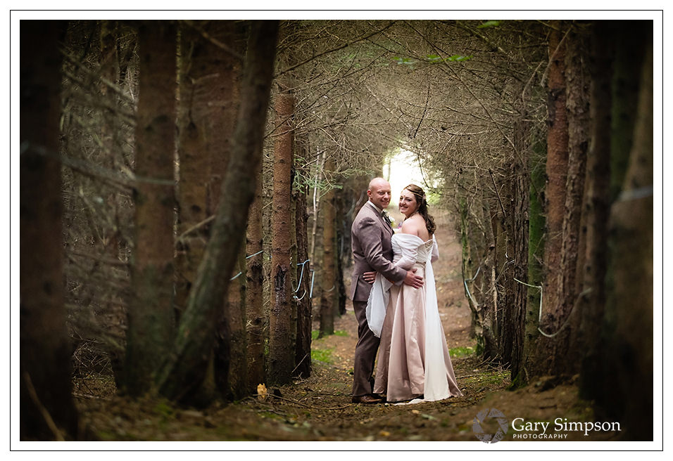 bride and groom portrait in the woods of camp katur