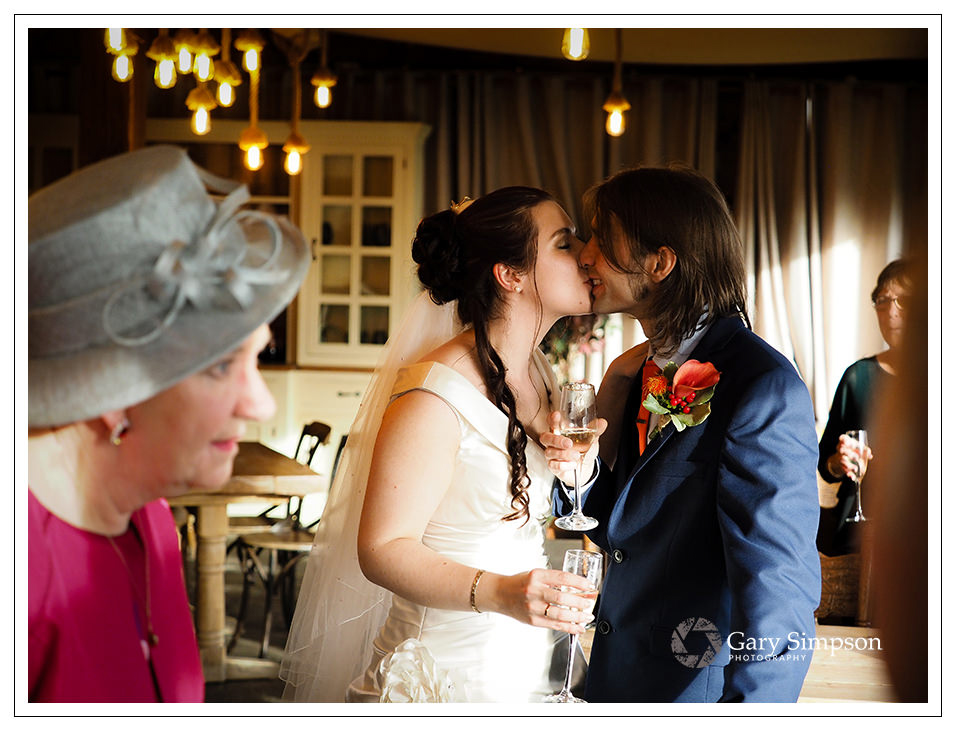 bride and groom share a kiss at crossbutts