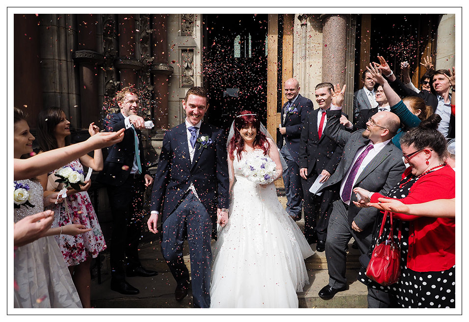 Confetti for the newly married couple outside St Wilfred's roman Catholic church