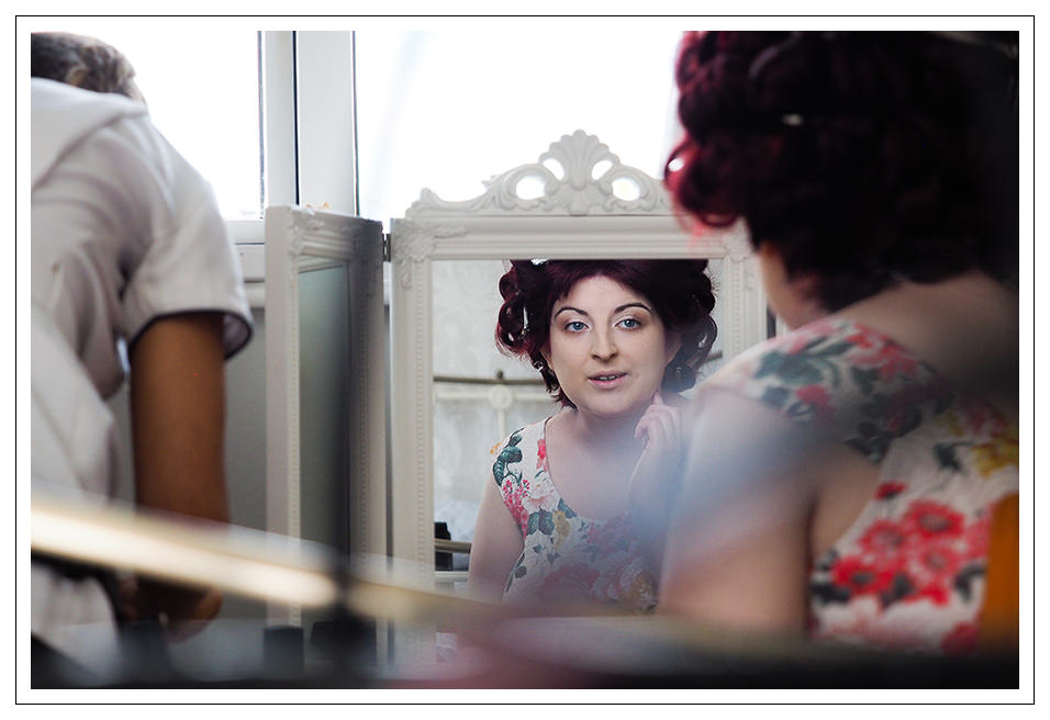 reflection of the bride during the hair and make