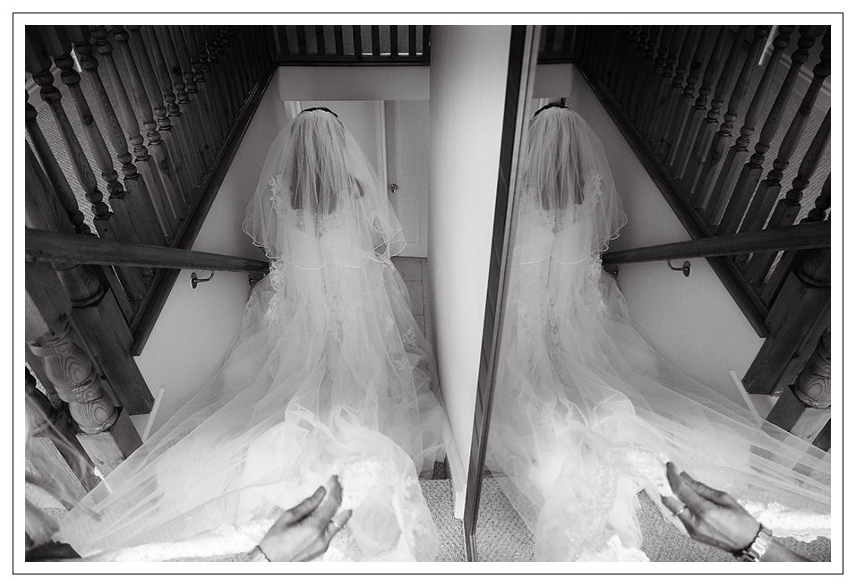 the bride leaving home for the ceremony and reflected in the mirror