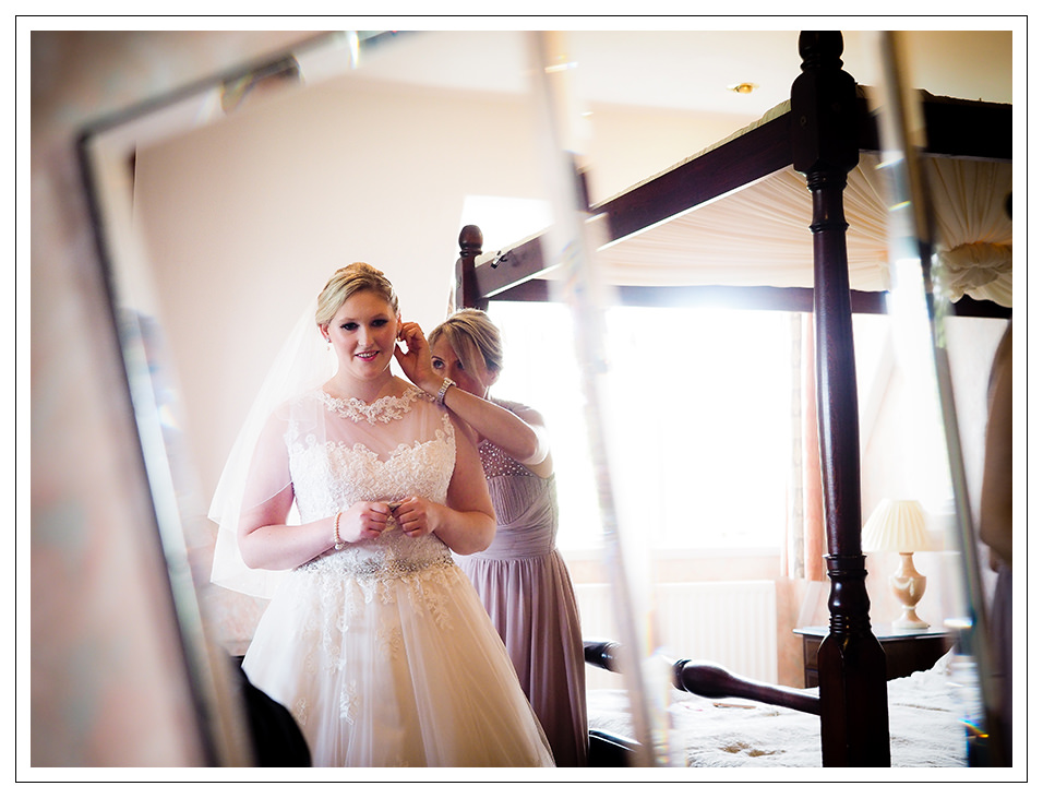 bride with her final touches at rushpool hall hotel