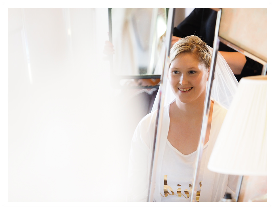 reflection of the bride during the bridal prep