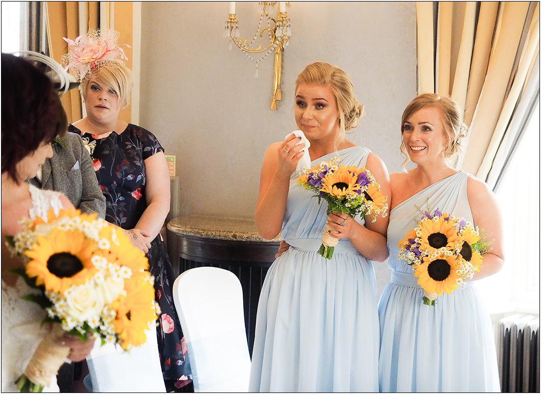 emotional bridesmaids during the wedding ceremony at oulton hall