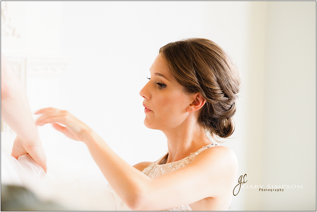 bridesmaid during the bridal preparation at the talbot hotel in malton