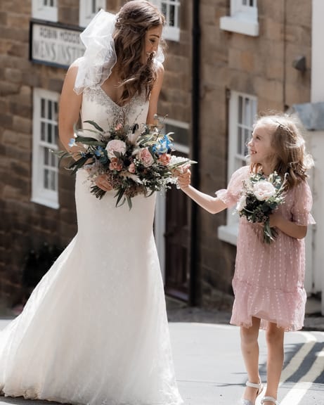 whitby wedding photographer in robin hoods bay with the bride and her daughter
