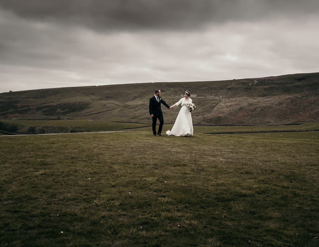 bride and groom portrait on the hills of the yorkshire dales